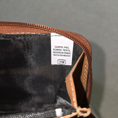Close-up of a leather wallet with a label