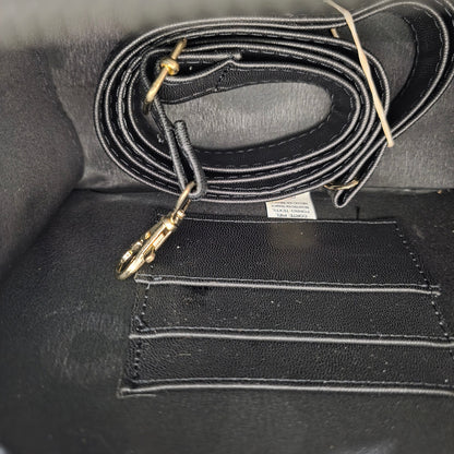 Black interior of handbag and detachable strap