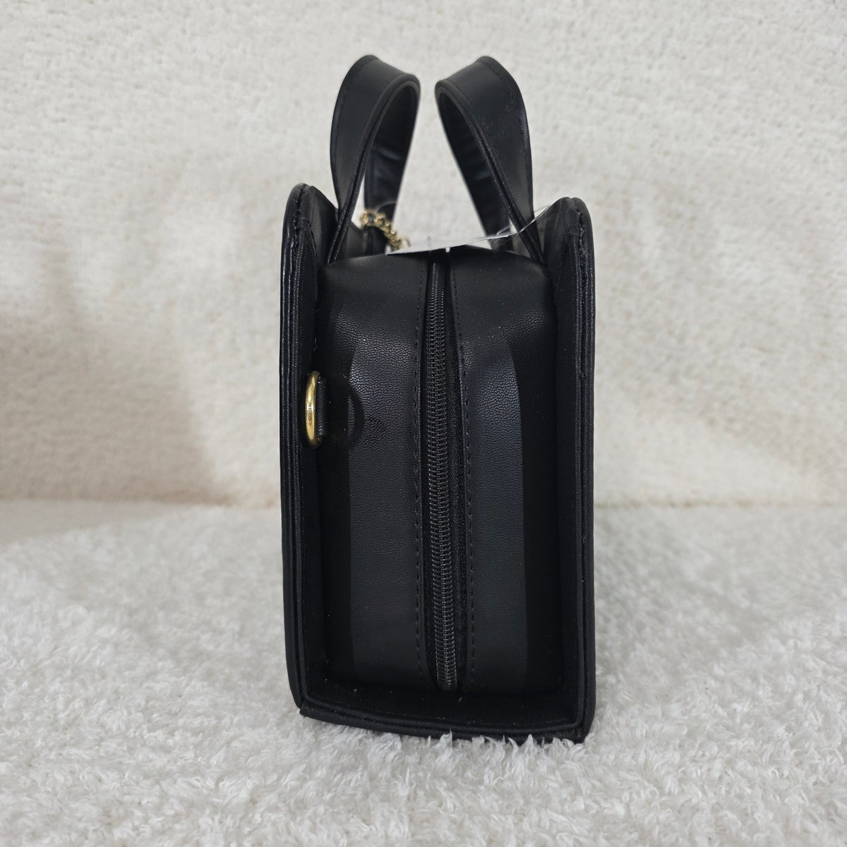 Black handbag with gold accents