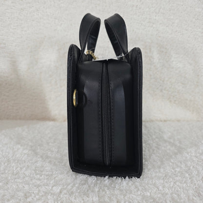 Black handbag with gold accents