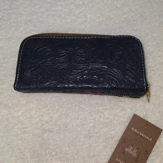 Blue embossed wallet with a visible brand tag 